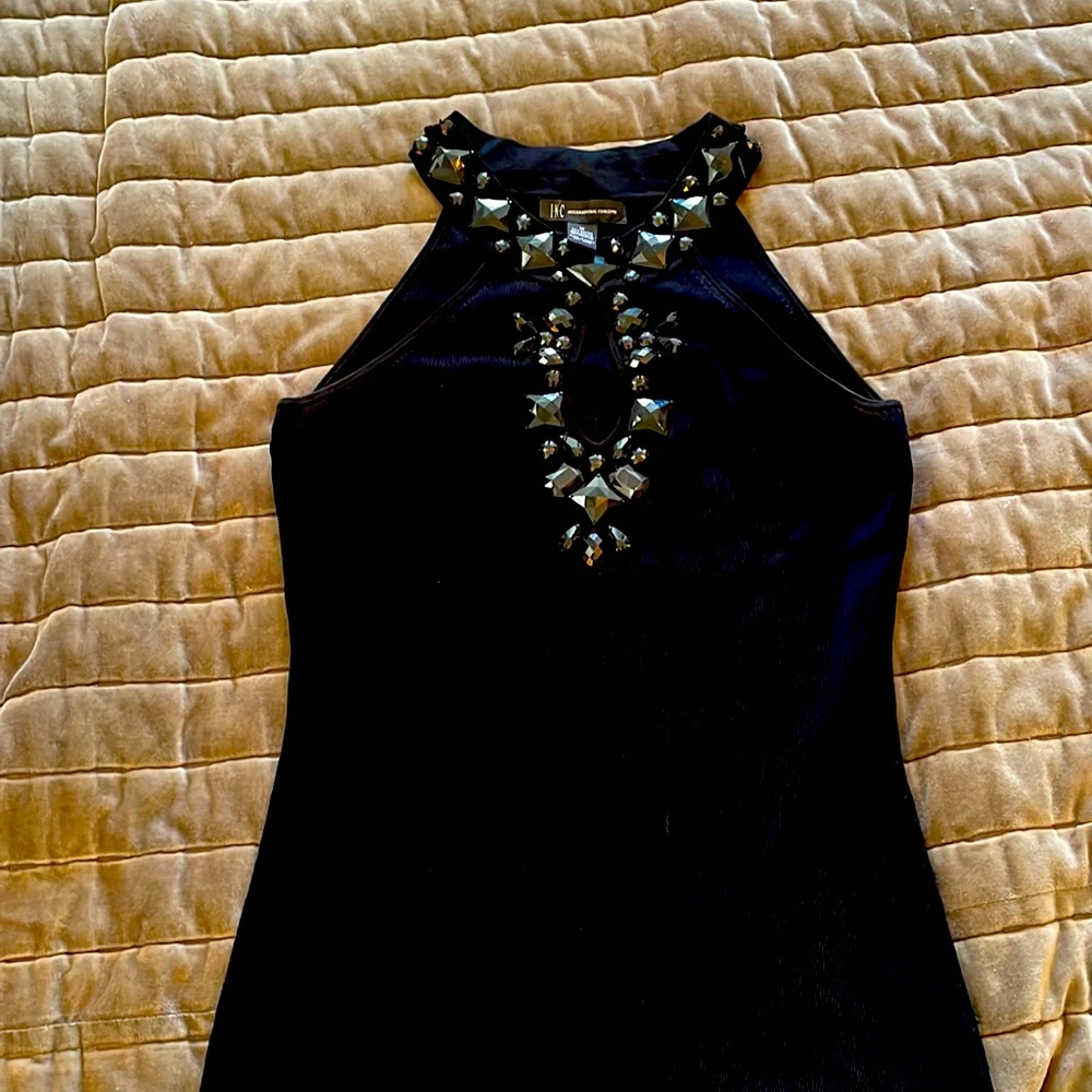 I.N.C. Top short sleeve with black embellishments around neckline and front.